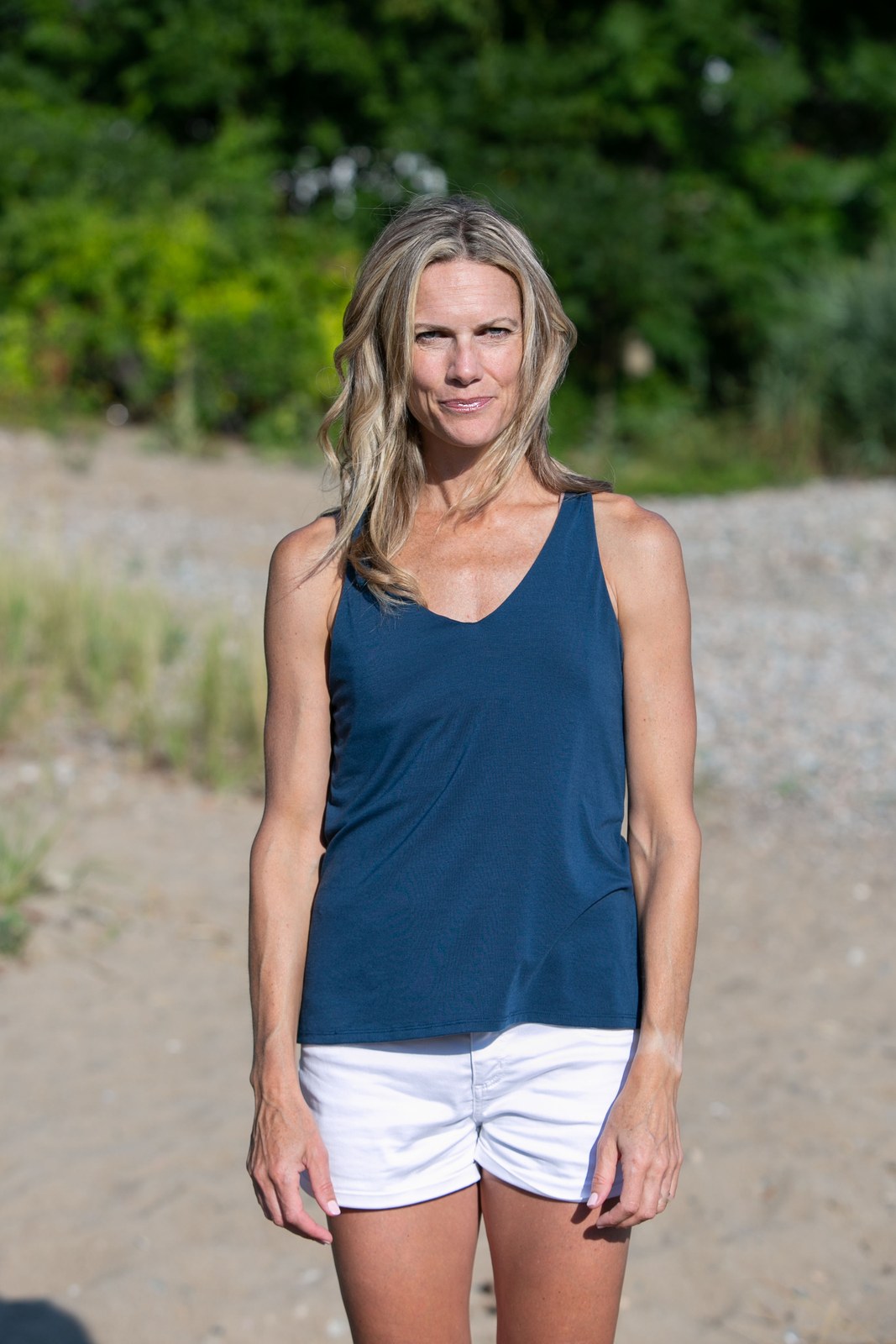 Val Hopkins on the beach in a navy tank