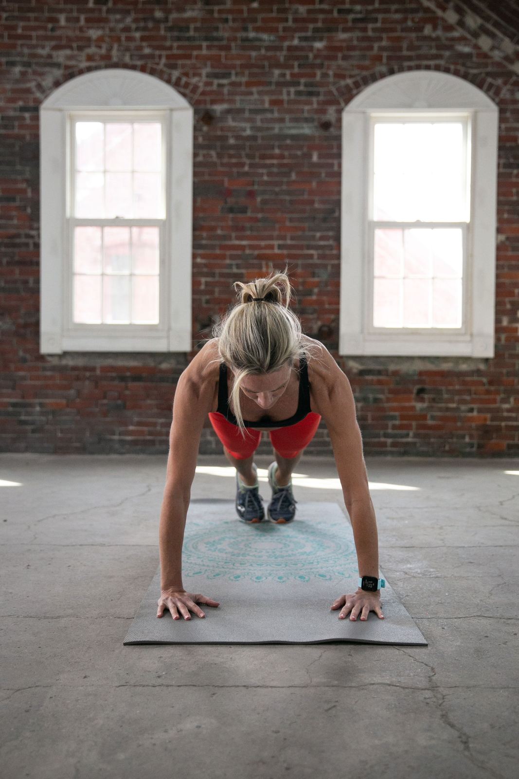 Val doing a push-up